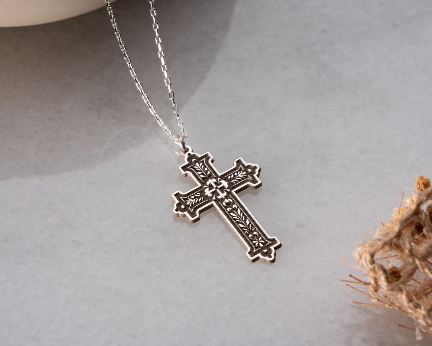 Ornate cross necklace close up