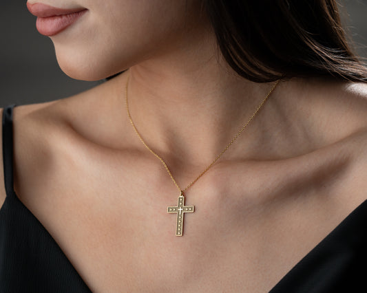 Textured Christian cross pendant close-up