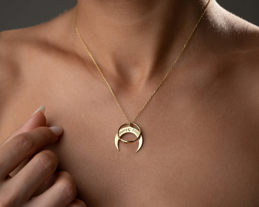 Model wearing a personalized moon ring holder necklace with a ring positioned on the crescent pendant