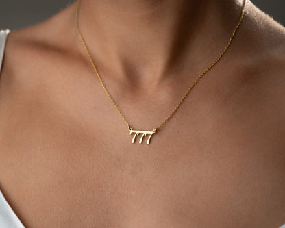 777 angel number necklace worn