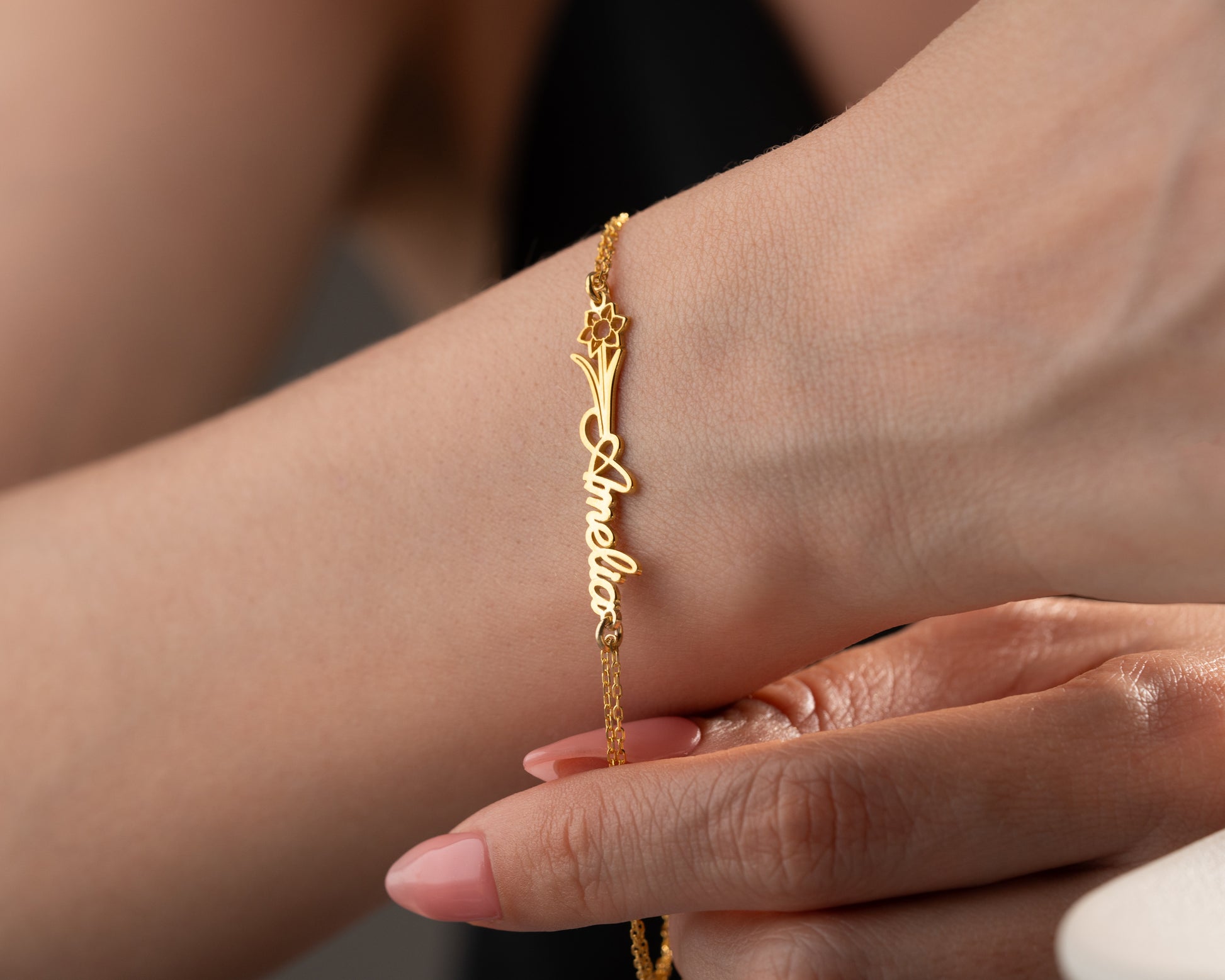 birth flower bracelet on wrist