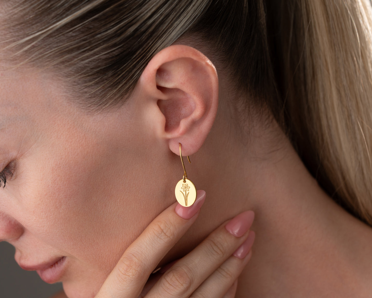 botanical earrings on ear