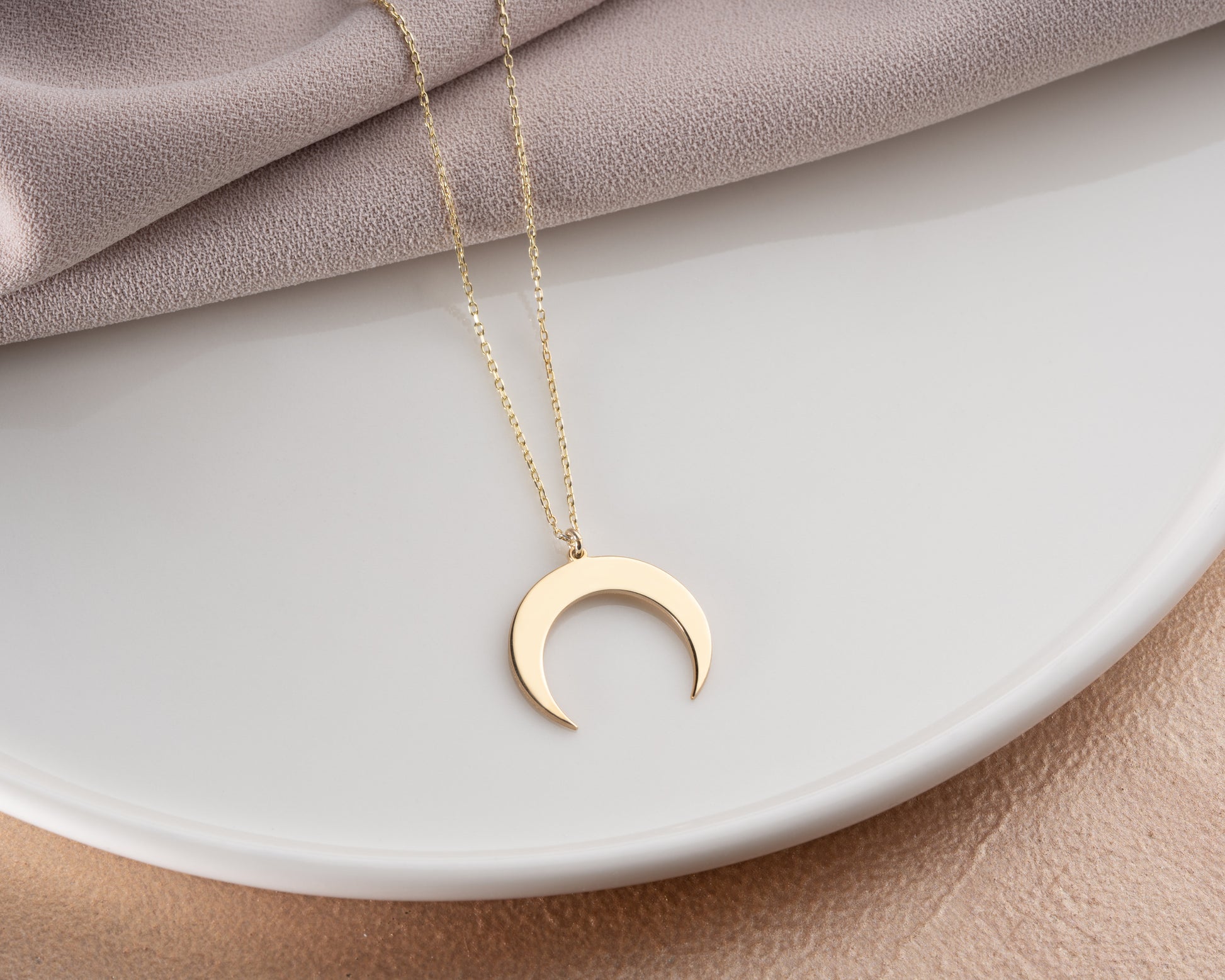 Crescent birthstone necklace on model