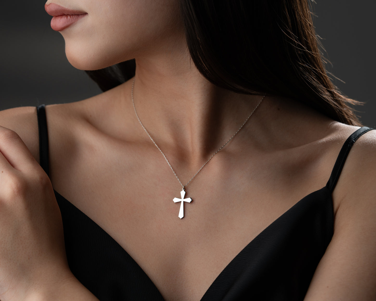 Cross necklace on model
