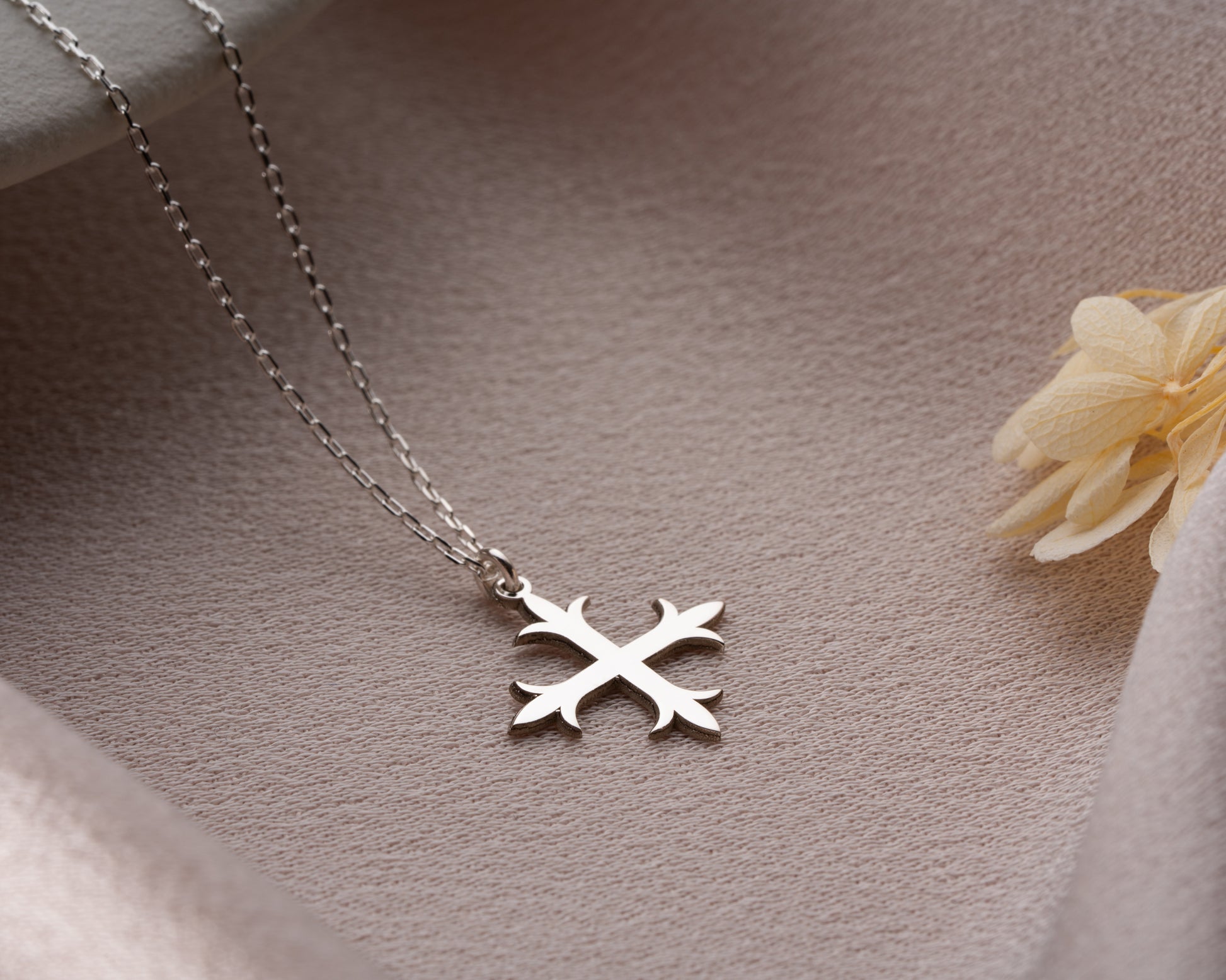 Decorative cross pendant detail