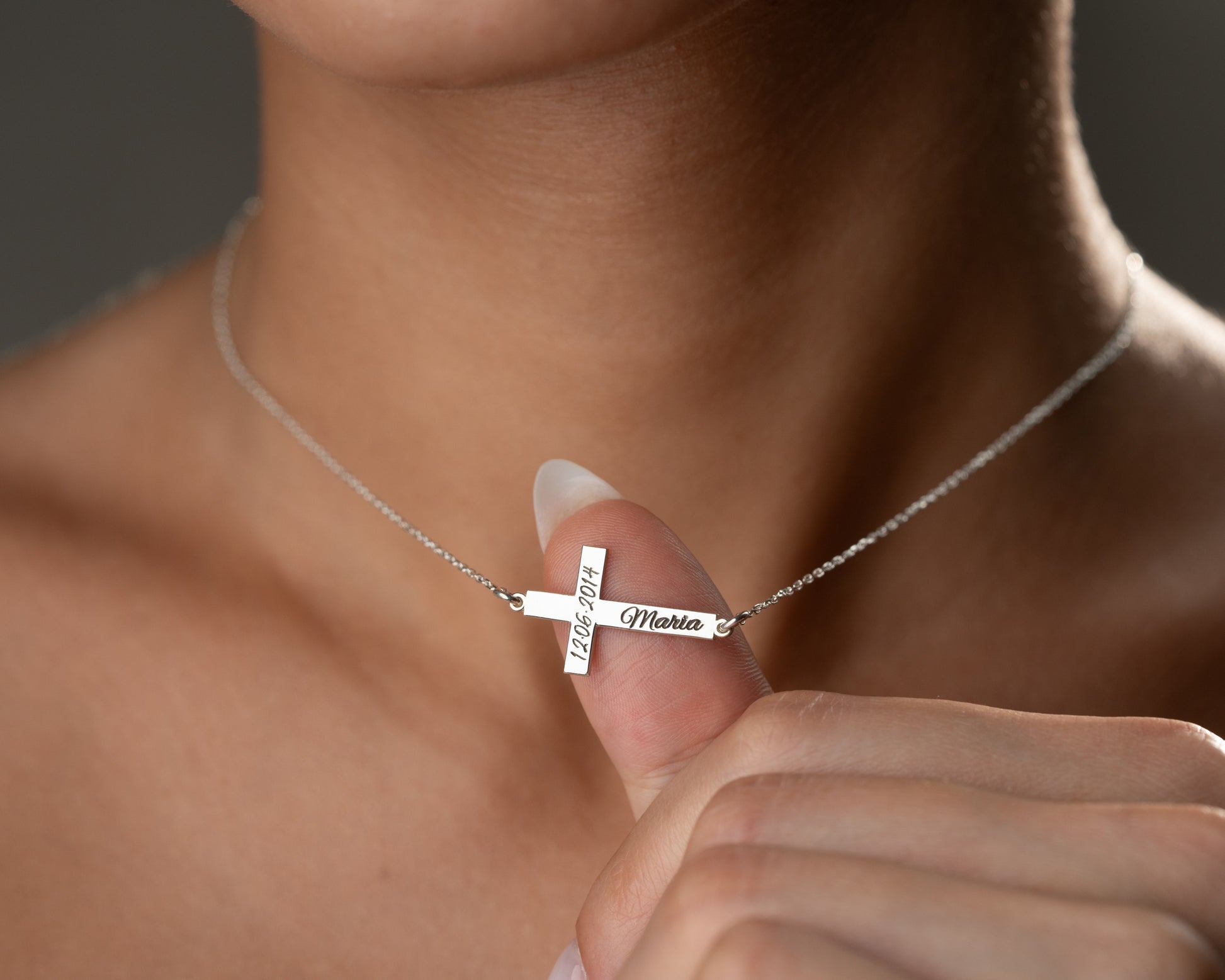 Engraved cross pendant close-up