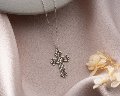 Engraved cross pendant detail