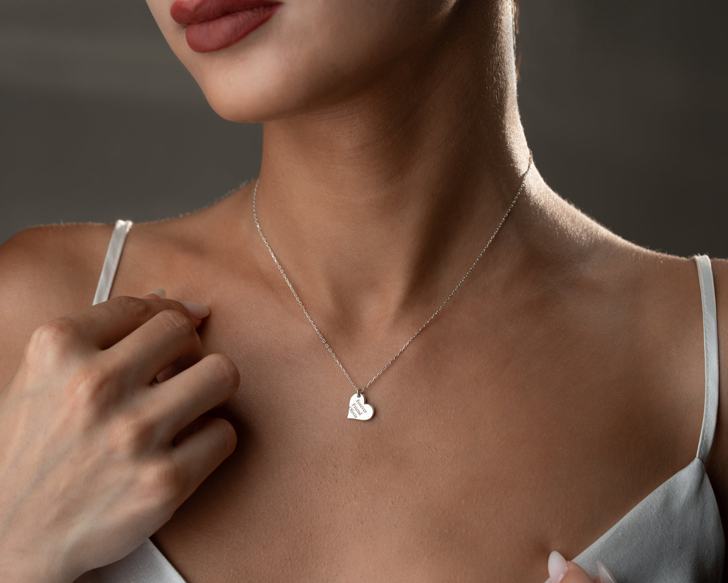 Engraved message necklace worn on model