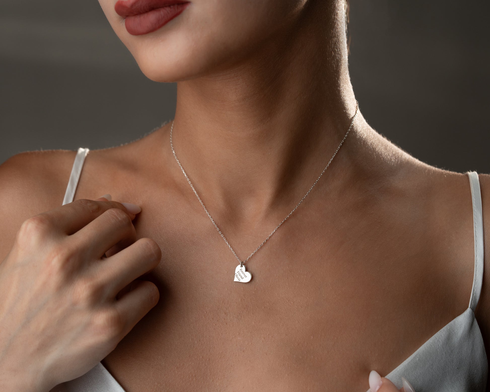 Engraved message necklace worn on model