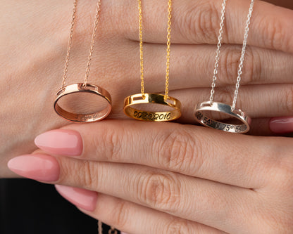Engraved ring pendant necklace with date and coordinates