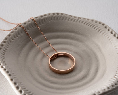 Engraved ring pendant necklace lifestyle detail