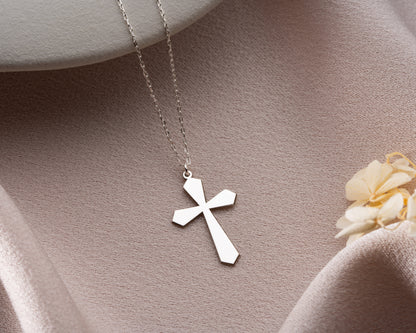 Flared cross necklace close up