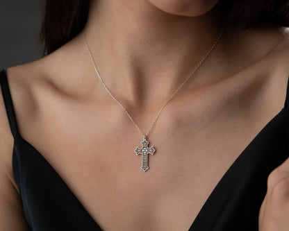 Floral cross necklace on model