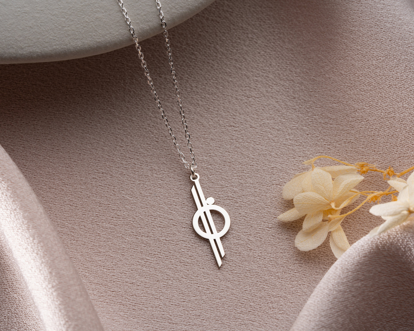 Geometric cross necklace detail