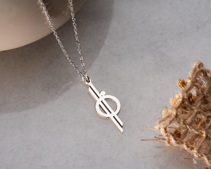 Geometric faith necklace detail