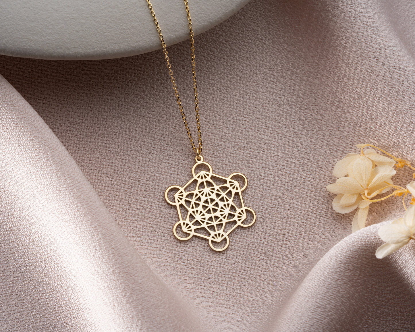 Gold Metatron's cube necklace close-up