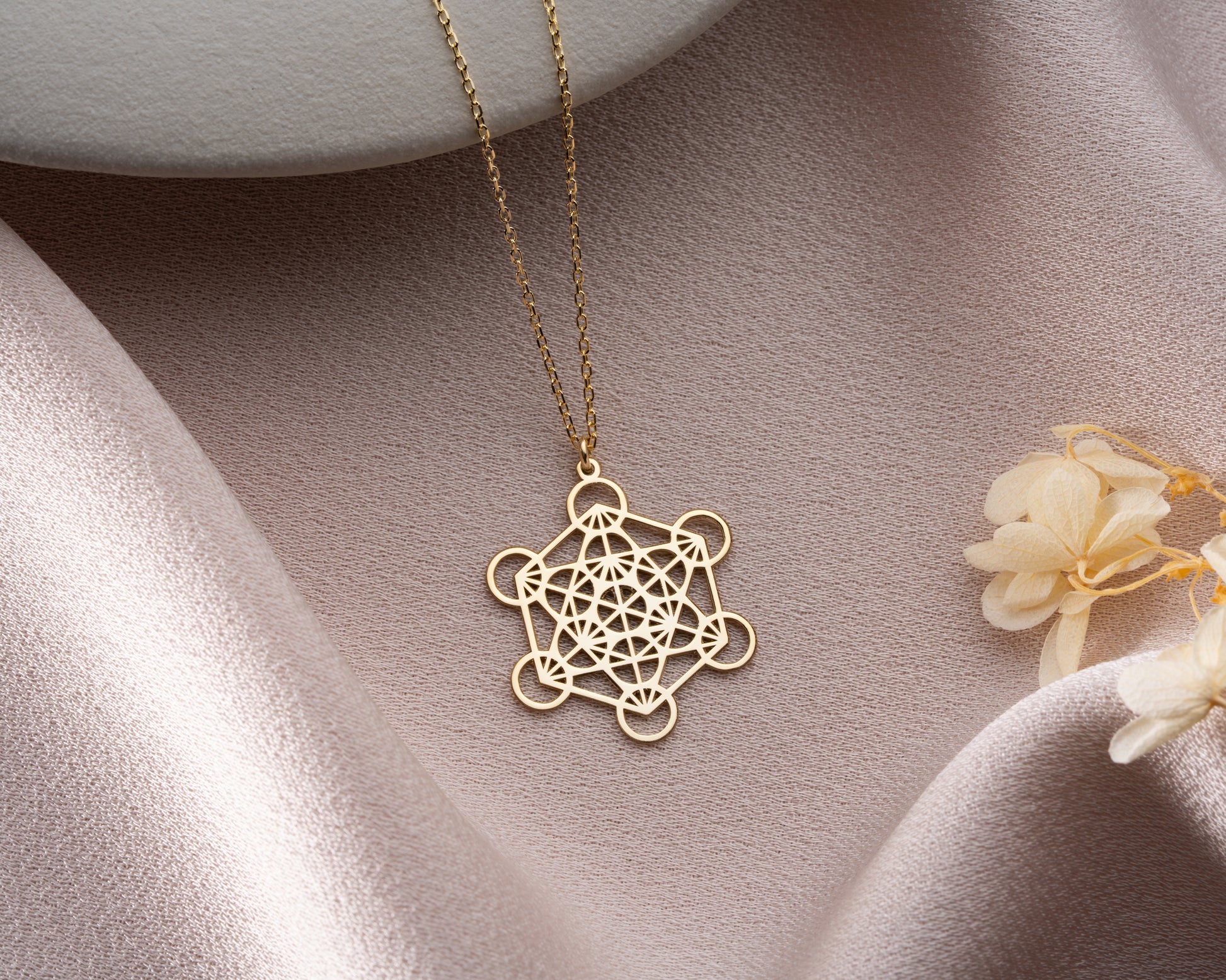 Gold Metatron's cube necklace close-up
