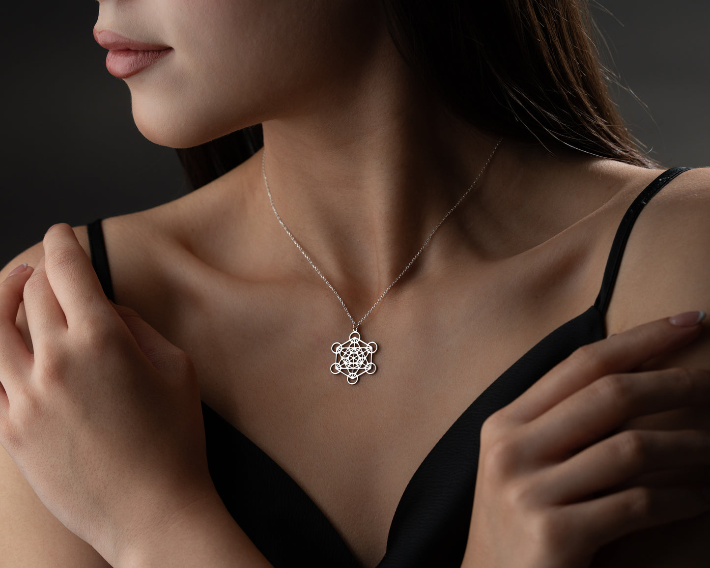 Gold Metatron's cube pendant worn