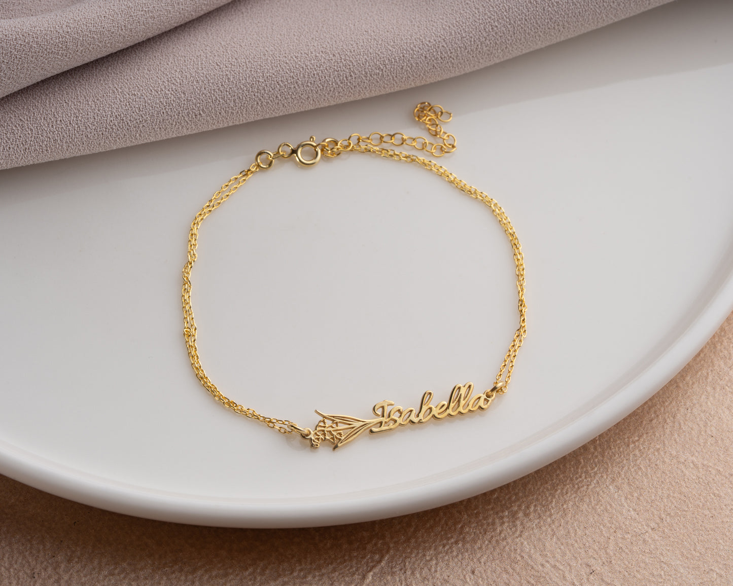 gold name bracelet display