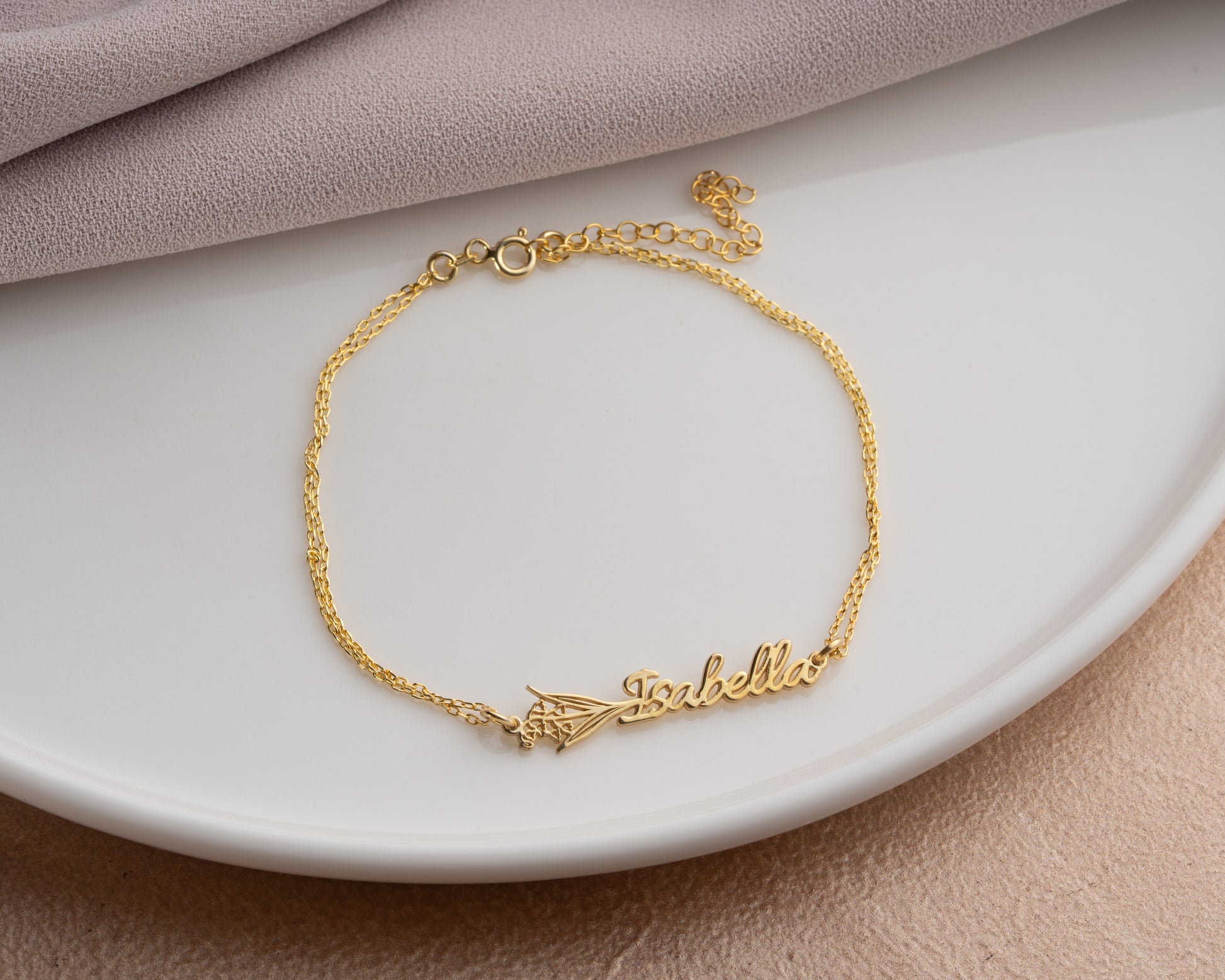 gold name bracelet display