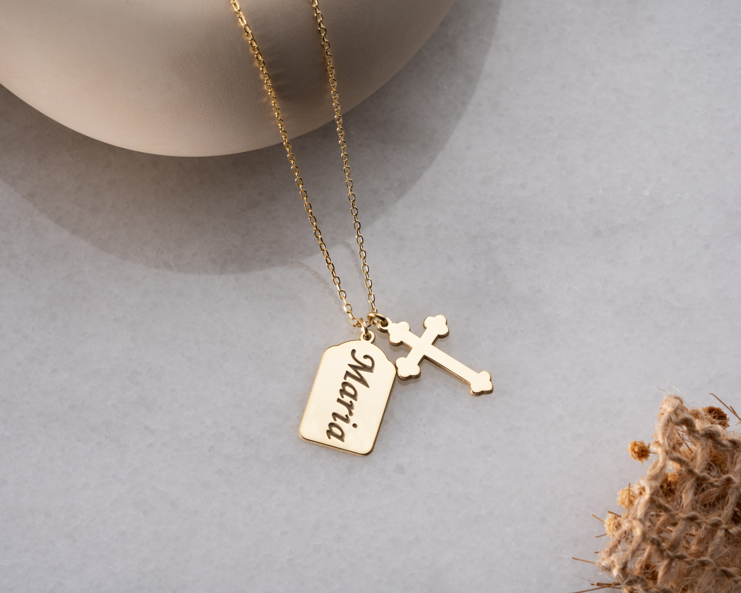 Gold personalized name cross necklace close-up