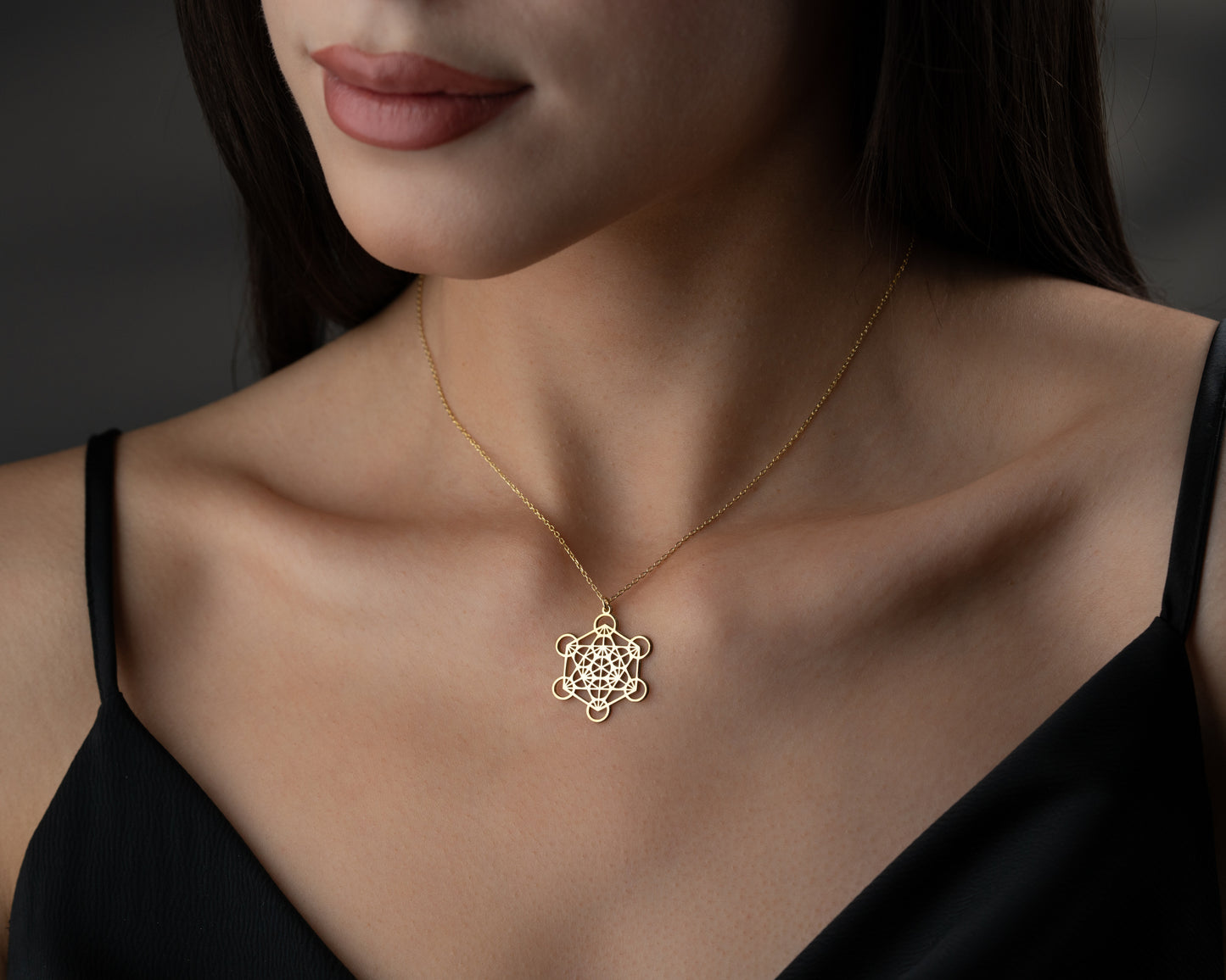 Silver Metatron's cube necklace on model