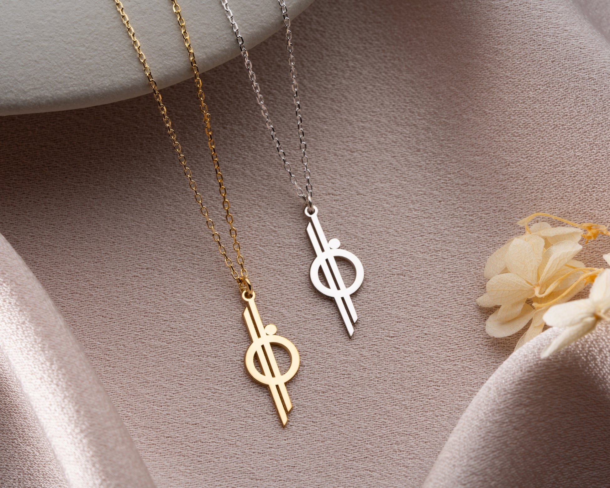Minimal cross necklace close up