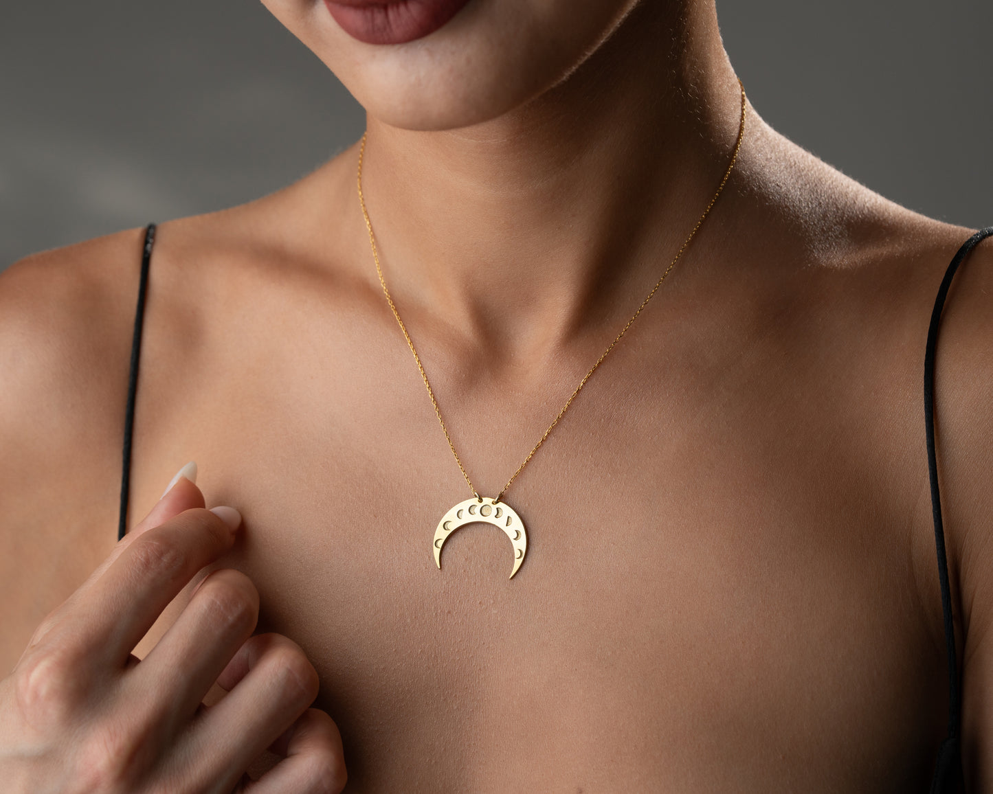Moon phase crescent pendant close-up