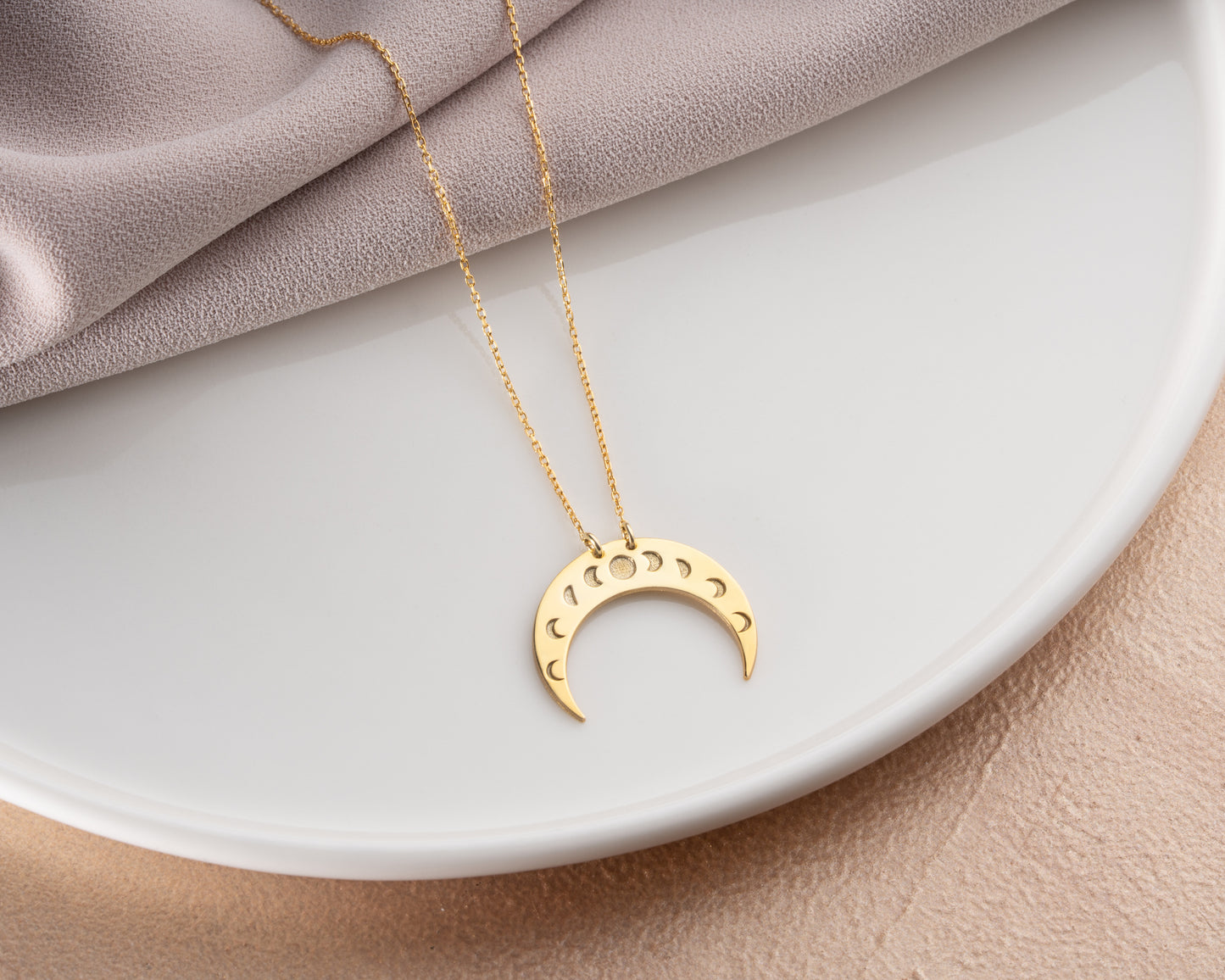 Moon phase crescent necklace on model