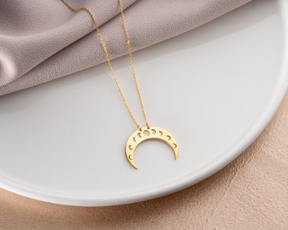 Moon phase crescent necklace on model