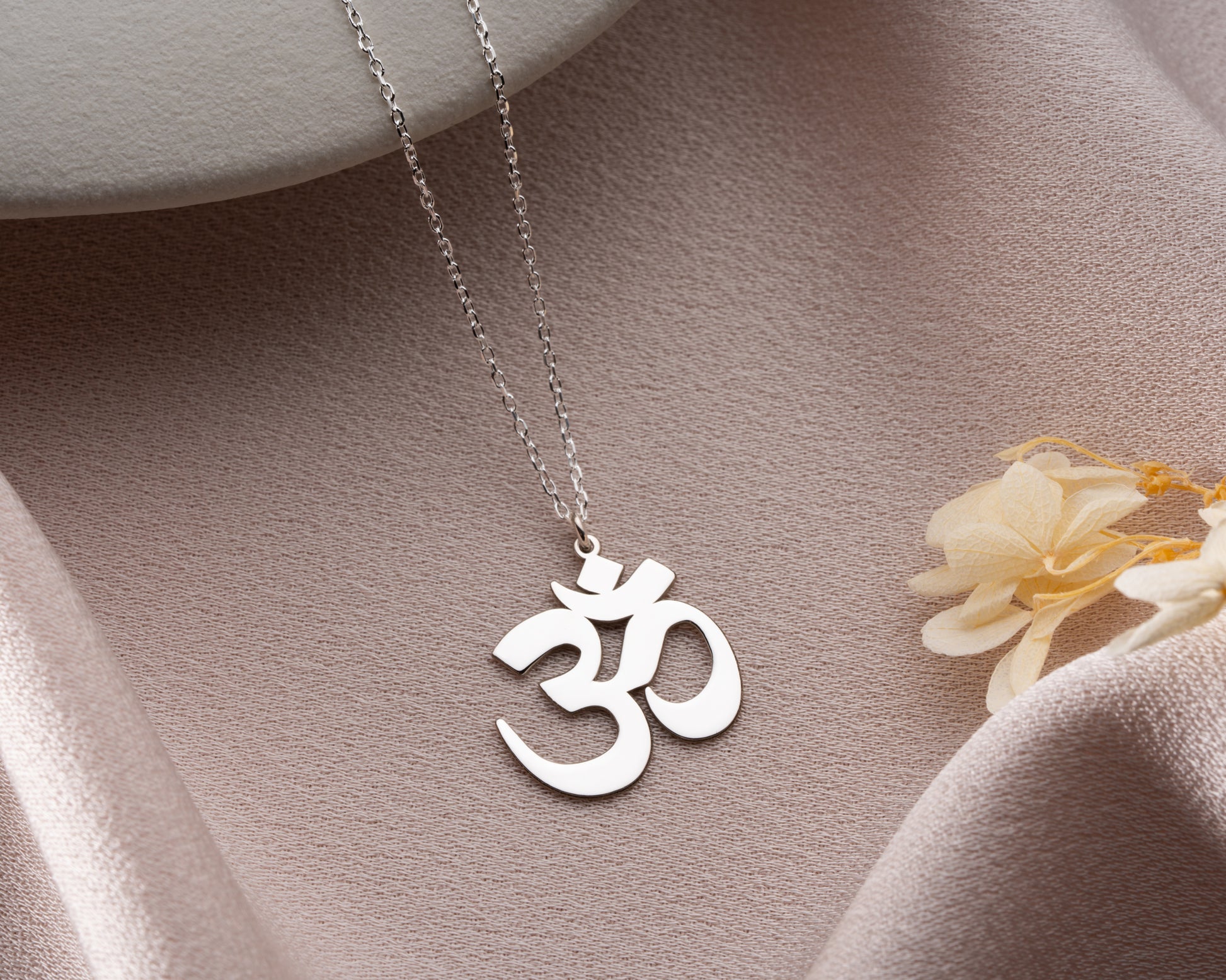 Om necklace close up