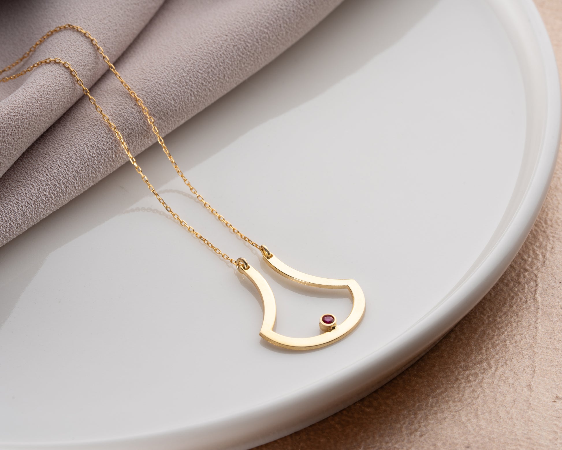 Open drop birthstone necklace on model