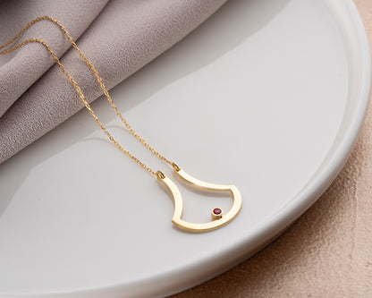 Open drop birthstone necklace on model