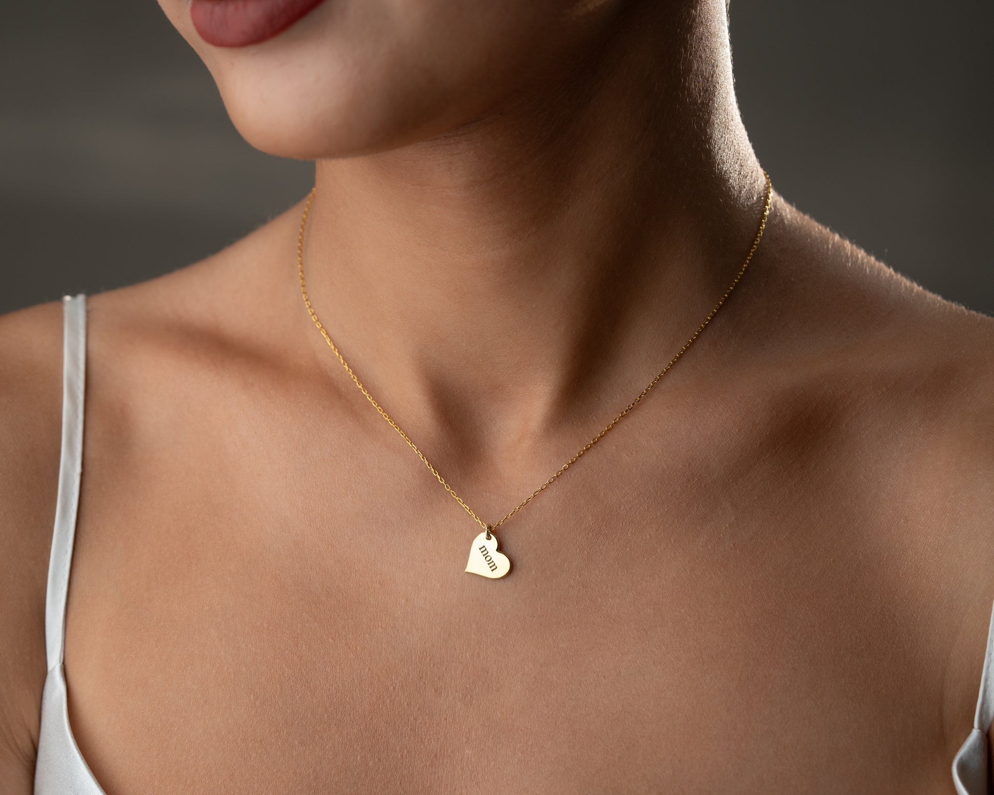 Personalized heart necklace worn on model