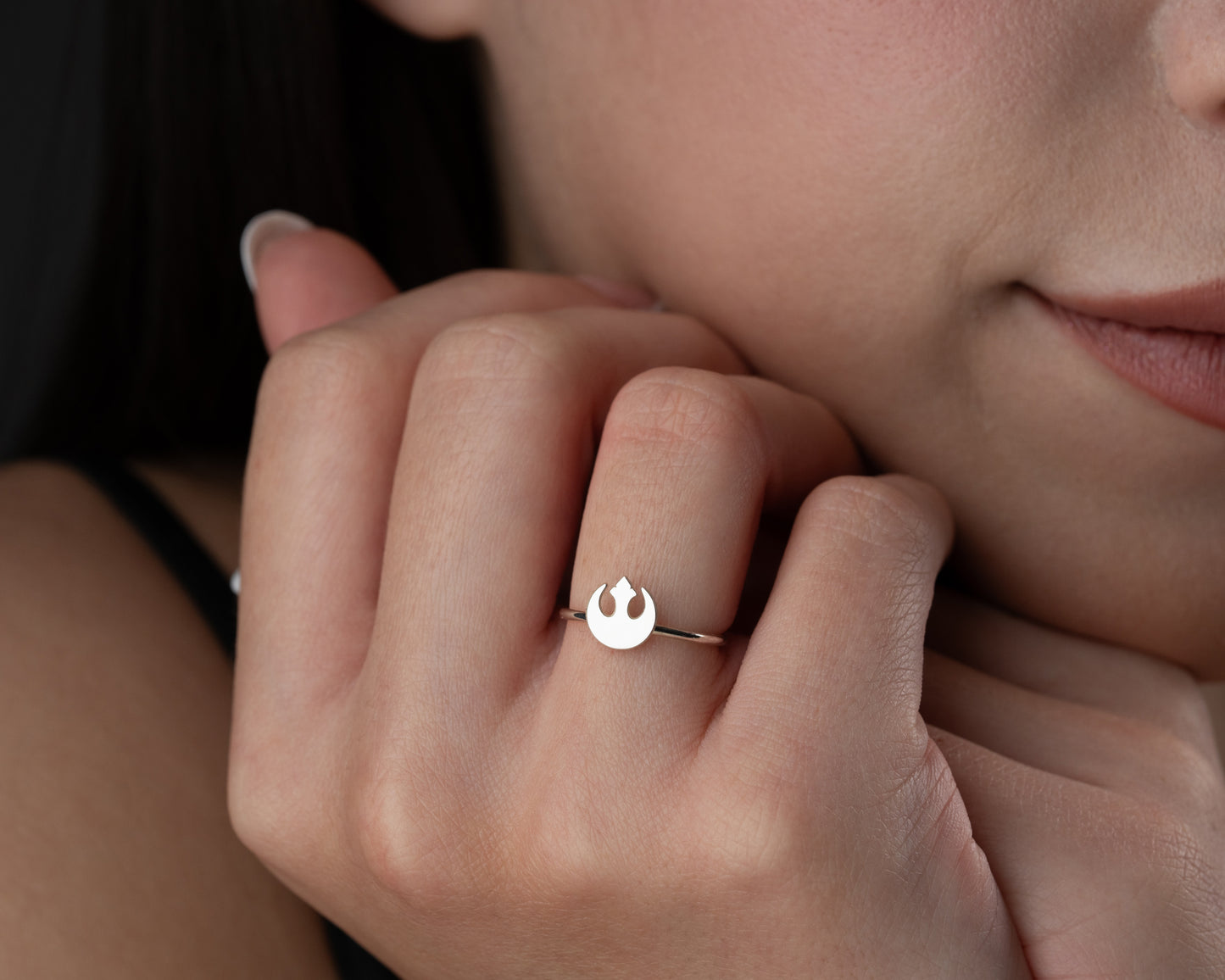 Rebel symbol inspired ring on hand