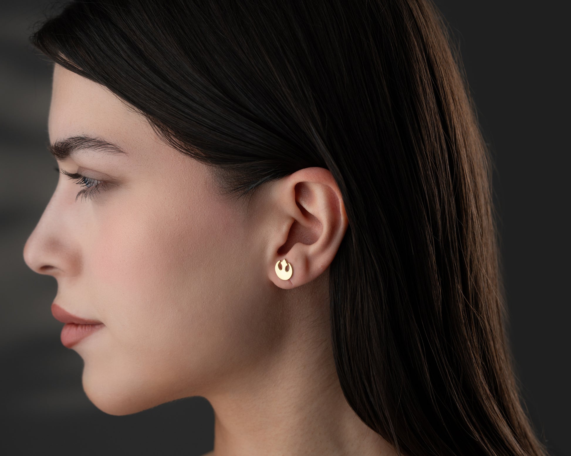 Rebel symbol inspired stud earrings on model