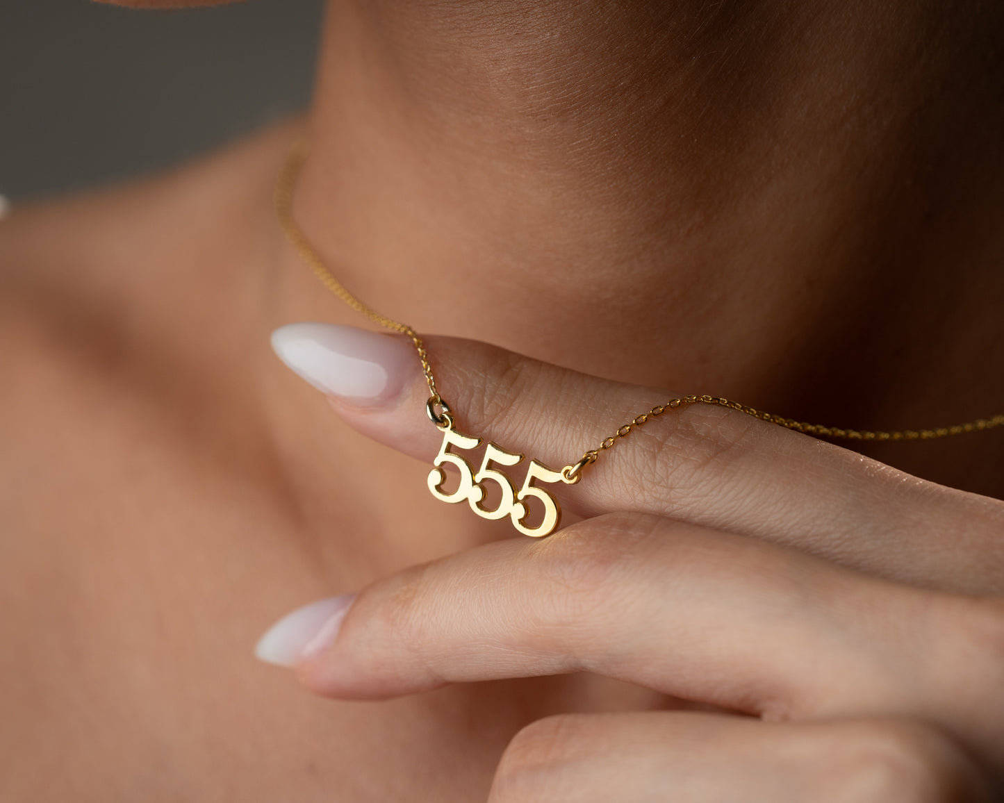 Repeating number pendant close-up