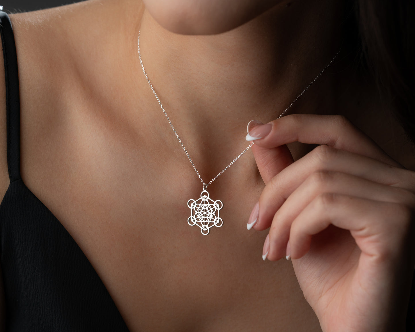 Silver Metatron's cube pendant worn