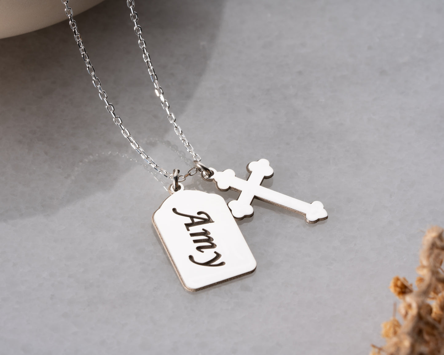 Silver personalized name cross necklace close-up
