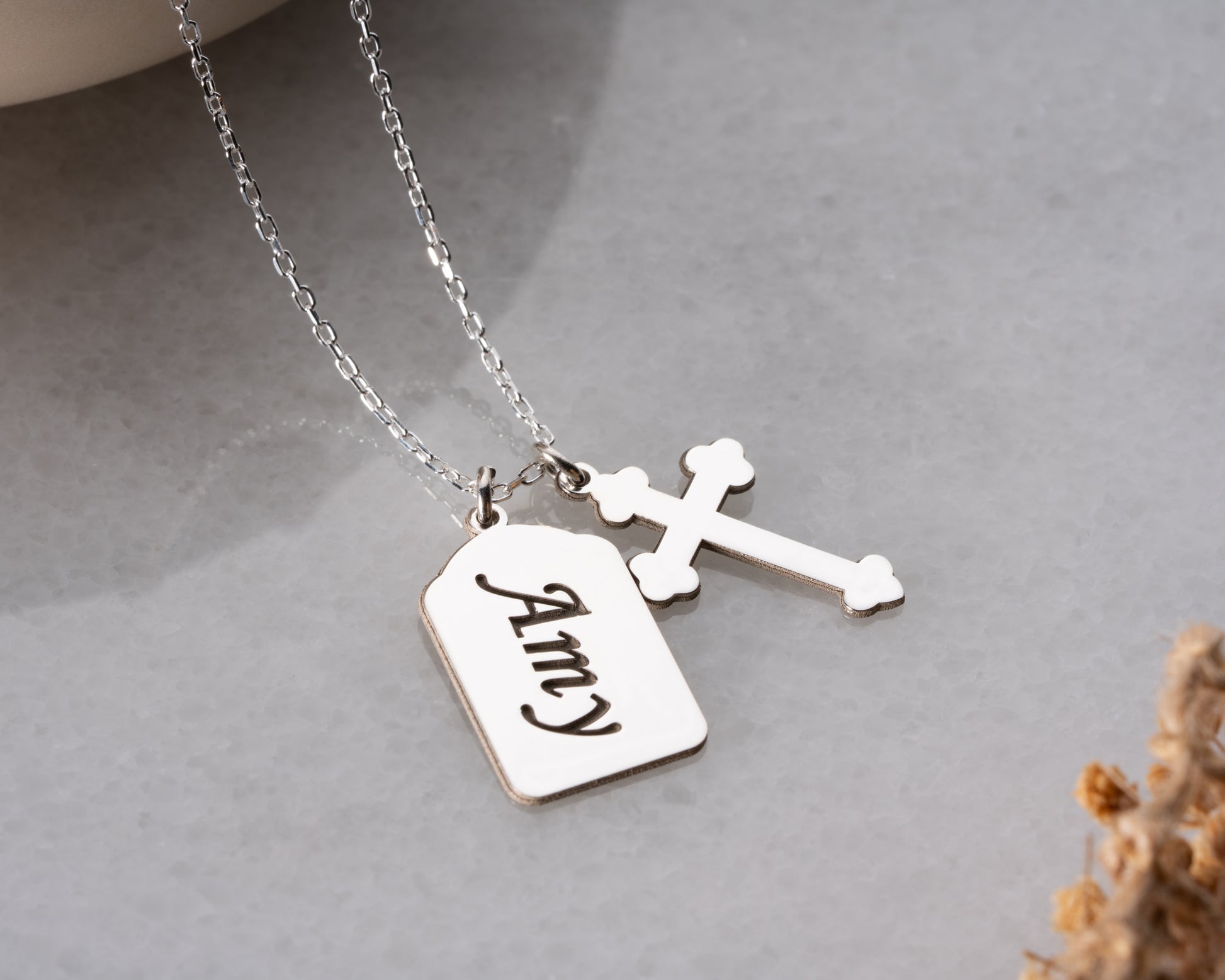 Silver personalized name cross necklace close-up