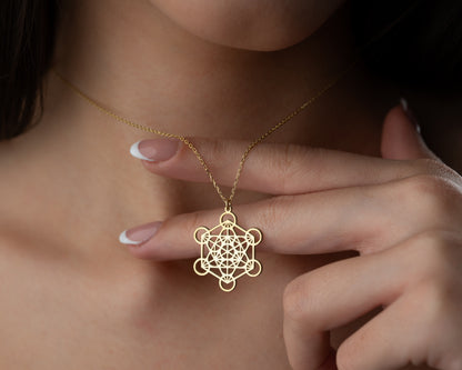 Silver sacred geometry necklace on model