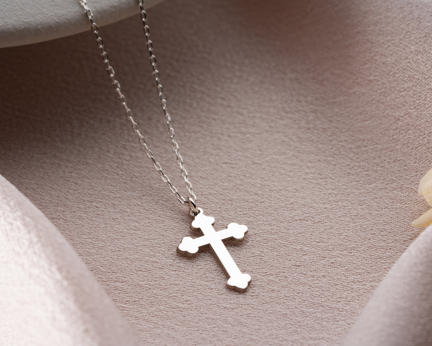 Silver trefoil cross pendant close-up