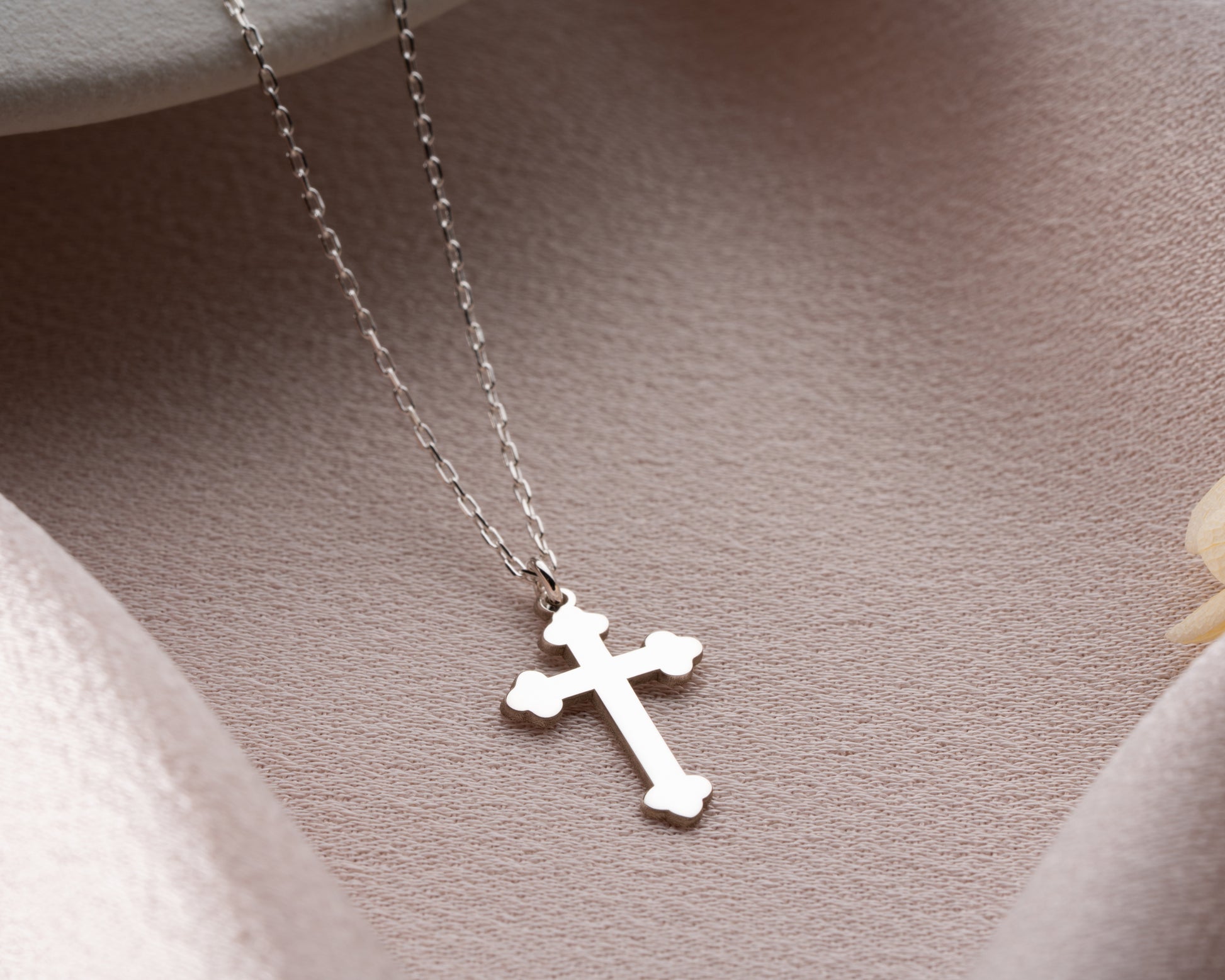 Silver trefoil cross pendant close-up